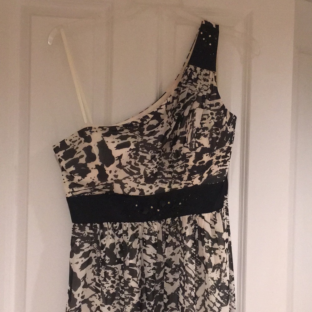 Full length black and white one shoulder gown